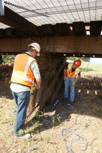 Researchers inspecting a bridge.